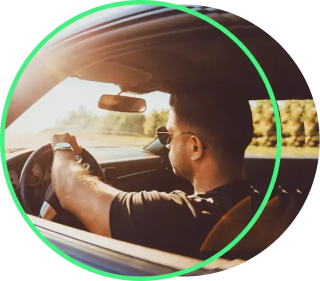 Man driving his car in a sunny day